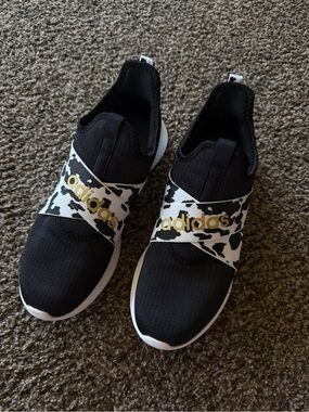 adidas Black Slip-On Sneakers with White Cowprint Strap and Gold Logo